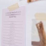 <title>The Newsletter Business: Beyond the Inbox</title> Close-up of a wall displaying a list of brand touchpoints for businesses.