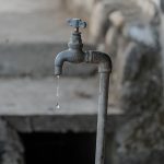 The Scarcity Trap: Why 'Aesthetic Efficiency' is Killing Your Innovation Pipeline A close-up of a rustic outdoor faucet dripping water against a natural, textured background, symbolizing scarcity.