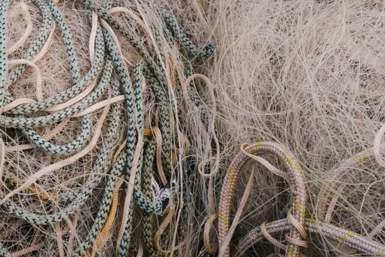 Close-up view of assorted ropes and nets revealing intricate textures and patterns.