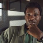 The Stoic CEO: Why Emotional Alchemy is the Ultimate Competitive Advantage Portrait of a thoughtful businessman posed indoors, exuding confidence and contemplation.