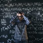 The Stoic Firewall: Why Logic Must Gatekeep Your Intuition Man in glasses focusing on math problems, struggling with complex equations on chalkboard.