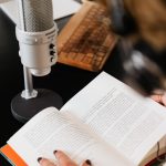 The Unreliable Narrator: Why Your Best Data is Often a Hallucination Close-up of a person reading with a microphone on a desk.