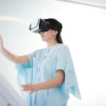 The VR Trap: Why Experiential History Can Cloud Strategic Judgment A woman wearing virtual reality goggles interacting with a digital interface inside a modern space.