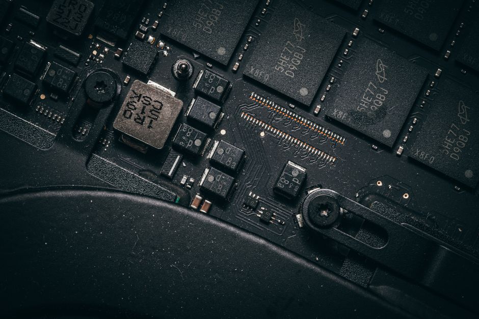 Detailed macro shot of electronic circuit board showing microchips and components.
